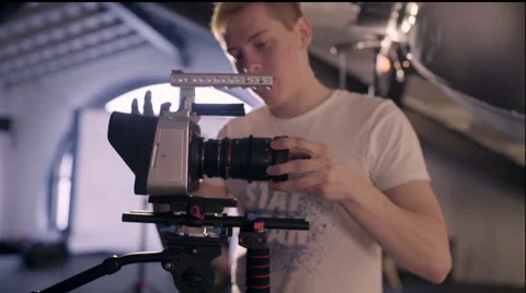 Behind the scenes. Operator checks the camera settings before shooting Stock Footage 62112741