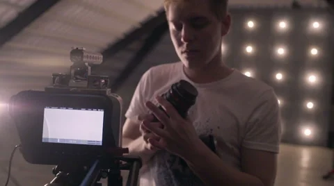 Behind the scenes. An operator film a scene of musical video with rock band on s Stock Footage 62114470