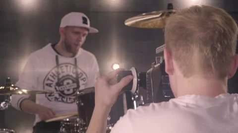 Behind the scenes. An operator film a scene of musical video with rock band on s Stock Footage 62115085