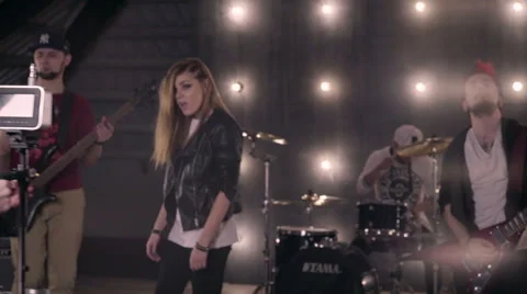 Behind the scenes. An operator film a scene of musical video with rock band on s Stock Footage 62115602