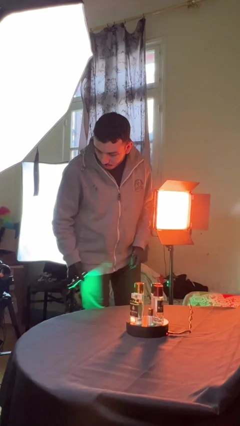Behind The Scenes Product Photography With Perfume Bottles In Home Studio Vídeo Stock 339428126