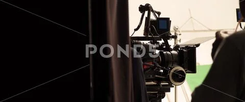 Behind the shooting production crew team and hd video camera. Stock-Fotos