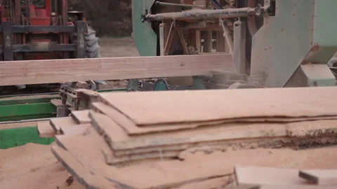 Behind some timbers a machine at work Stock Footage 271165042