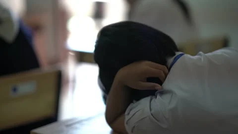 Behind student sitting in classroom for education test Vídeos de archivo 163082551