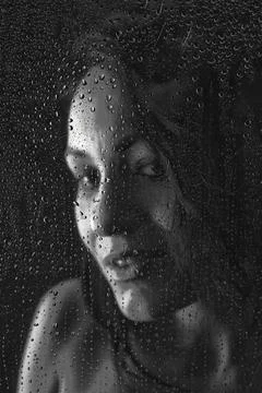 Behind water drops Stock Photos