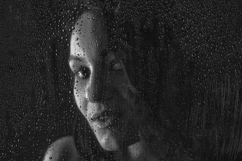 Behind water drops Stock Photos