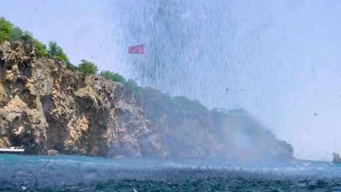 Behind the Waterfall Falls Over the Cliff, Inside the Sea View Stock Footage 146338388