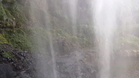 Behind the waterfall in the Jungle 4K Stock Footage 61773335