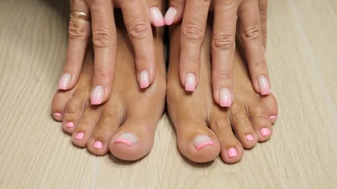 Behold the elegance as the refined hands of a lady tenderly meet her pampered Video stock 264788526