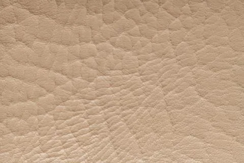 Beige artificial leather with large texture. Artificial skin. Close-up. Bac.. Foto stock
