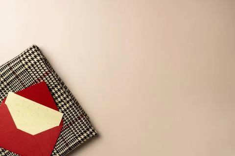 Beige background with soft scarf and blank card on beige background. Space .. Stock Photos