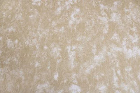 Beige background with white spots Stock-Fotos