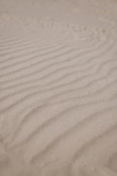 Beige beach sand waves surface texture. Desert dune landscape Stock Photos