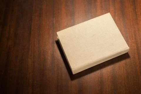 Beige book on the table Stock Photos