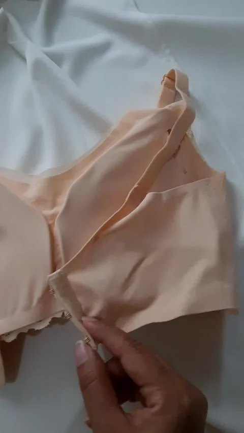 Beige Bra on White Bedroom Sheets Stock Footage 331419968
