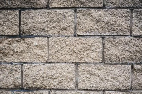 Beige brick wall pattern &amp; background. Stockfoto's