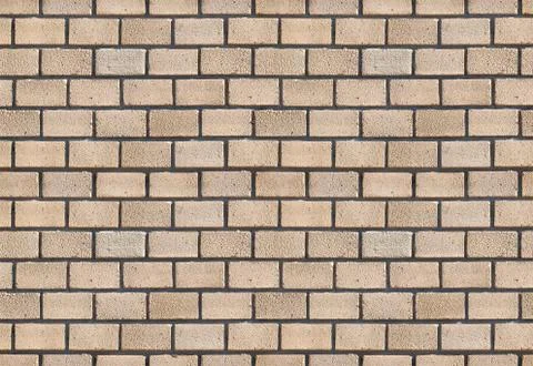 Beige brick wall. Stock Photos