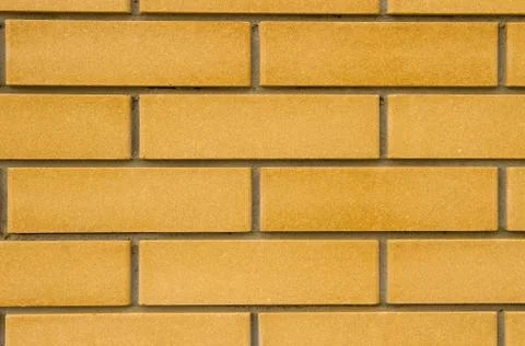 Beige brick wall. Stock Photos