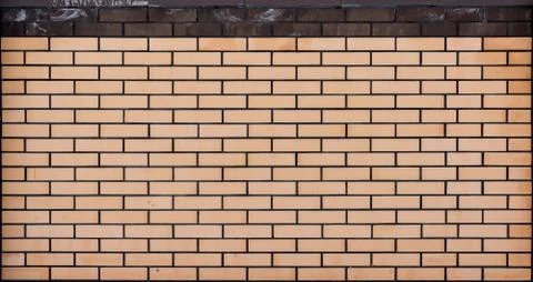 Beige brick wall texture Stock Photos