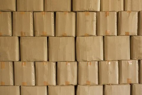 Beige cardboard boxes stand in stack. rough surface texture Stock Photos