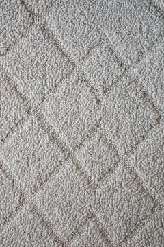 Beige Carpet With Diamond Pattern And Soft Textured Surface Foto stock