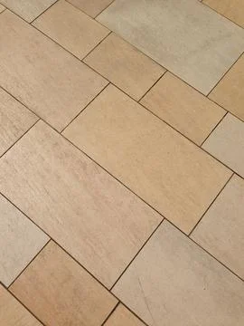 Beige ceramic tiles arranged in rectangular pattern Stock Photos