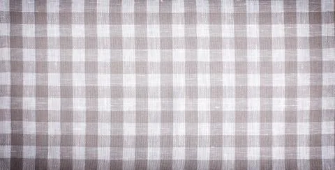 Beige checkered tablecloth, textile, kitchen  vintage  background, linen fabr Stock Photos