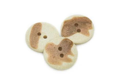 Beige clothes buttons Stock Photos