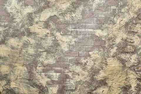 Beige copper gray brick wall with  yellow waves spots for text and decor Stock Photos