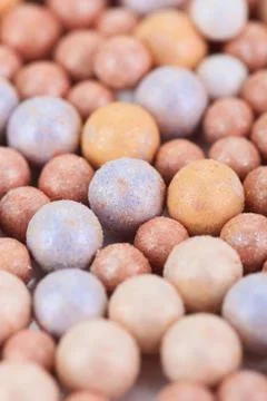 Beige cosmetics multicolor rouge balls background, macro view Foto stock