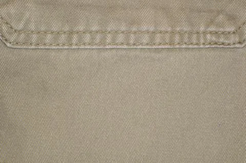 Beige denim close up background Stock Photos