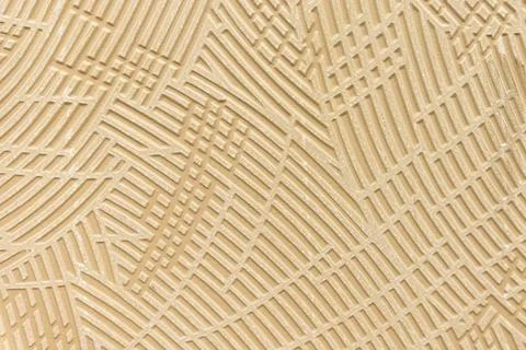 Beige embossed geometric grooved pattern texture background on ceramic surfac Stock Photos