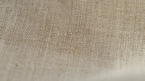Beige fabric close-up, light brown cloth texture background. Macro shooting of Stock Footage 168619433
