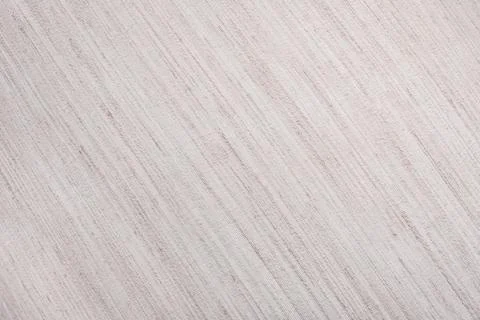 Beige fabric texture. A beige background with a pattern of lines. Stock Photos