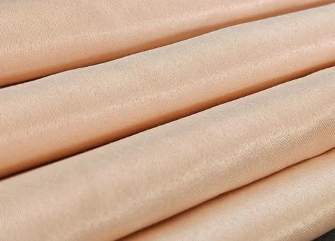 Beige Fabric Texture with Soft Folded Natural Textile Background Stock Photos
