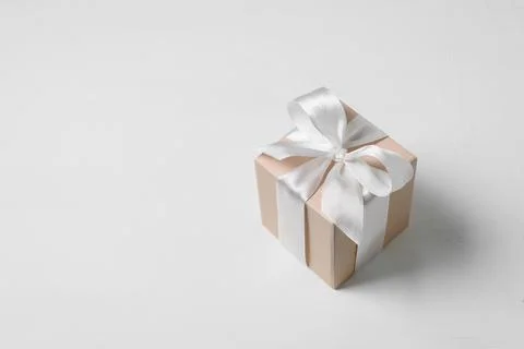 Beige gift box with bow Stock Photos
