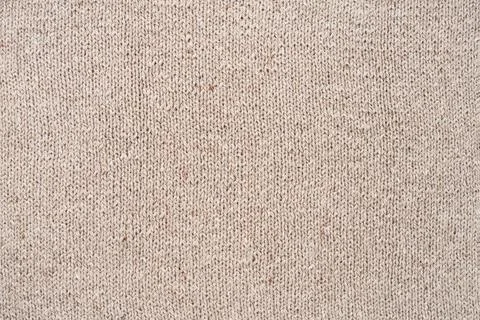 Beige handmade knitwork, wool knitwork for artisan backdrop or background. Beige Foto stock