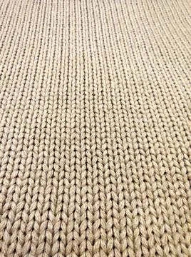 Beige knitted material for textile background, perspective view Stock Photos