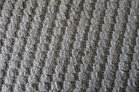 Beige knitted textile fabric texture background with cozy woven pattern Stock Photos