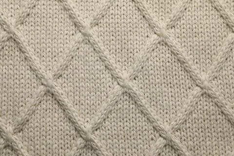 Beige knitted wool texture as background, top view Stock Photos