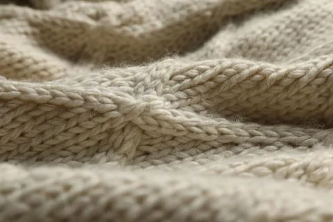 Beige knitted wool texture as background, closeup Stock Photos