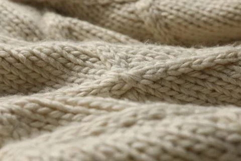 Beige knitted wool texture as background, closeup Stock Photos