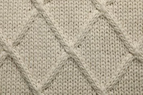 Beige knitted wool texture as background, top view Stock Photos
