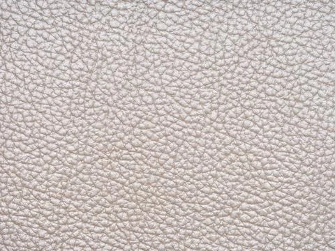 Beige leather texture sample. Genuine leather material closeup in light, soft Stock Photos