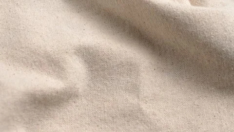 Beige linen fabric texture background with soft folds Stock Footage 335686384