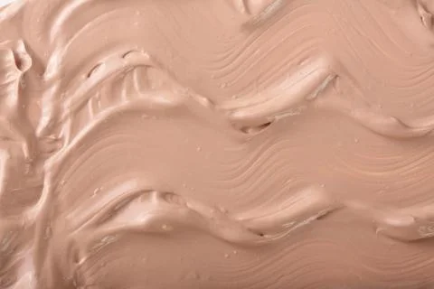 Beige liquid foundation makeup as a background. Top view. Flat lay pattern Foto stock