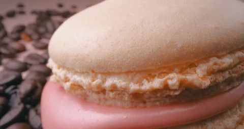 Beige Macaron With Coffee Beans On Pink Background. Macro. Stock Footage 108925251