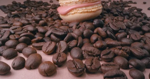 Beige Macaron With Coffee Beans On Pink Background. Macro. Stock Footage 108925982