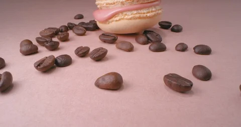 Beige Macaron With Coffee Beans On Pink Background. Macro. Stock Footage 108926717