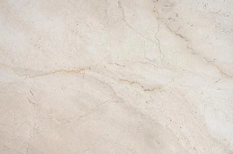 A beige marble background with subtle brown veining and a natural stone tex.. Stock Photos